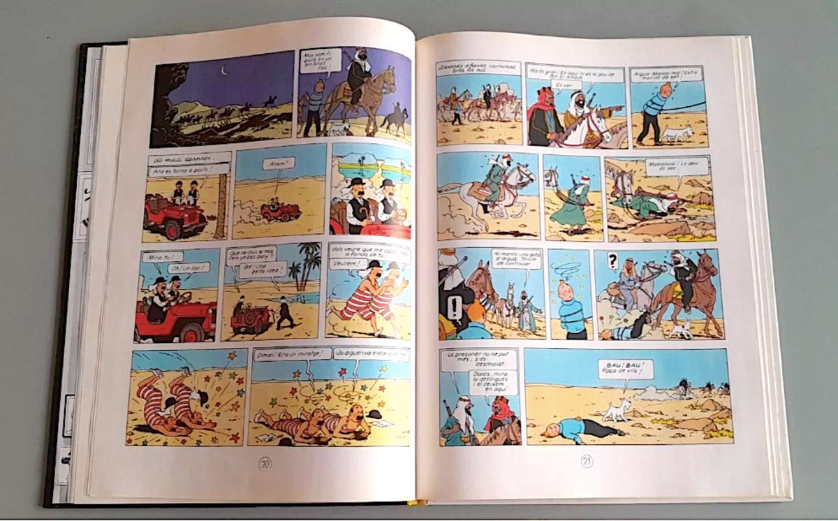 Dues pàgines de l'exemplar de 'Tintín al País de l'Or Negre' en alguerès, que ha sortit a subhasta amb un preu de  sortida de 6.800 euros / Ebay