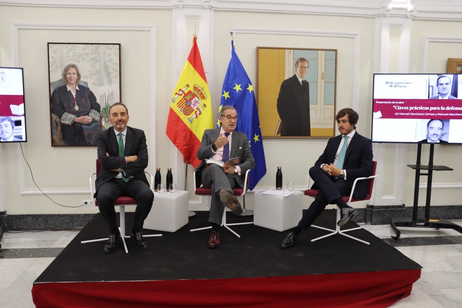 Una fotografia de Manuel Marchena i el seu fill presentant el llibre de dret penal/ICAM