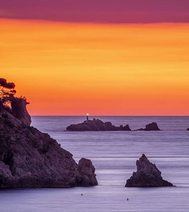 El sol es fon amb l’horitzó desde Cala Estreta